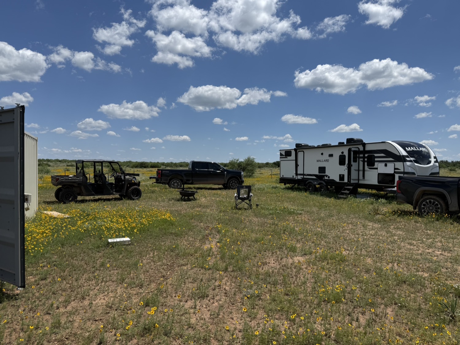 Camp setup with RV and vehicles